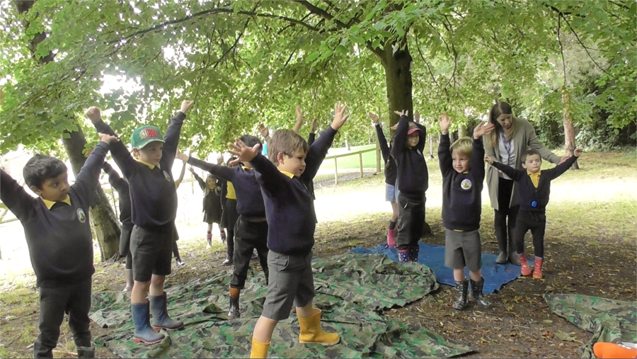 Primary KS1 children doing Mindful Movement in Jigsaw Outdoors