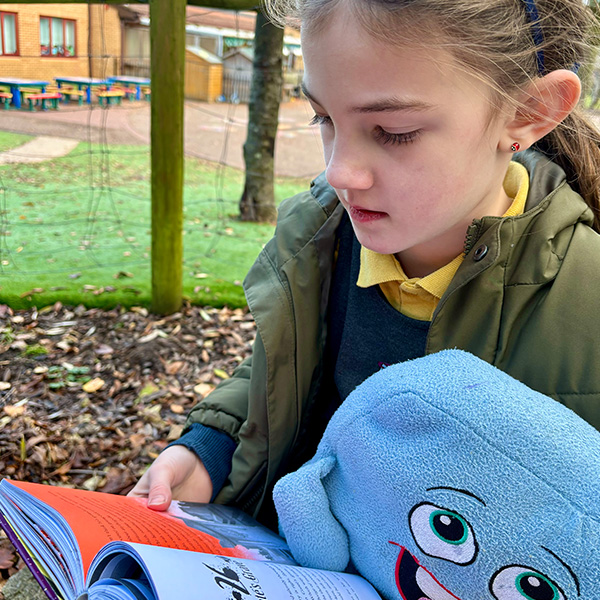 Child Reading Outside.jpg