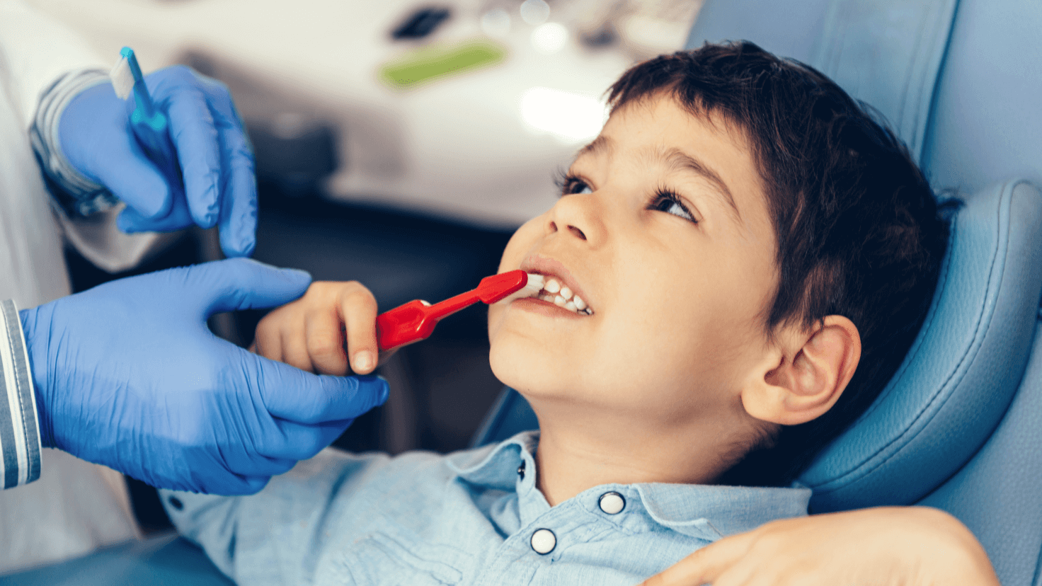 A boy brushing his teeth