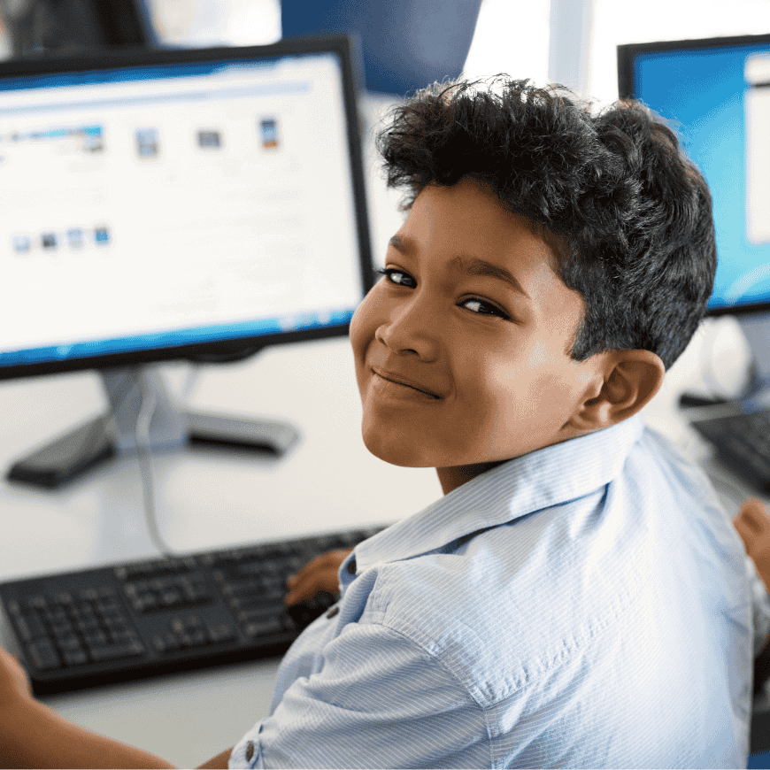A boy sitting at a computer