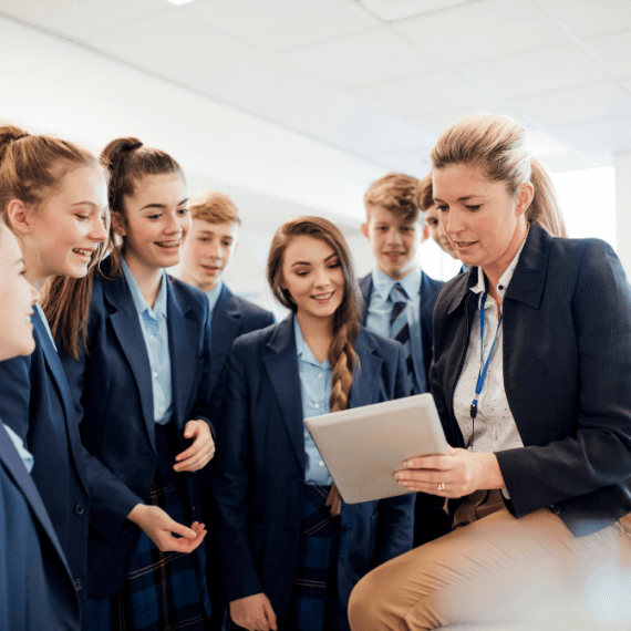 Group of children looking at a result with a teacher