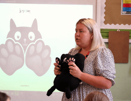 Teacher holding Jerry cat