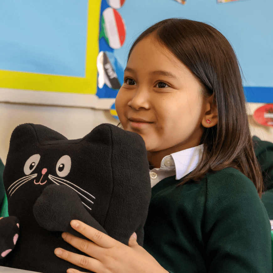 Child holding Jerry cat