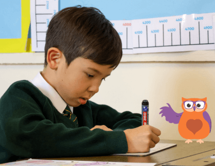 Boy writing in note book
