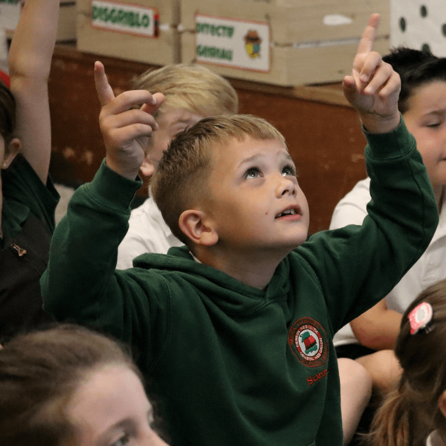 Boy pointing up to the sky
