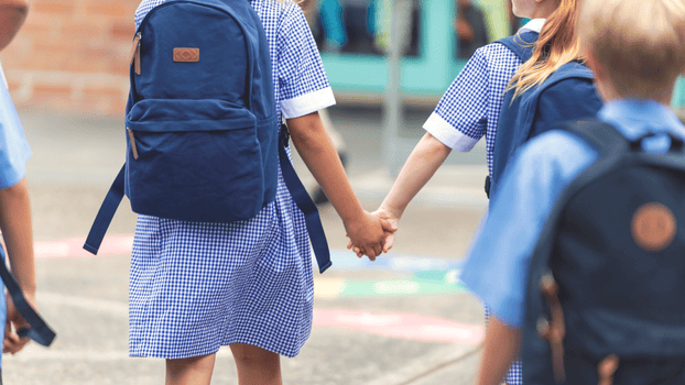 Two girls holding hands together
