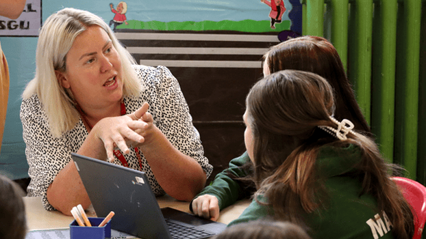 A teacher talking to children