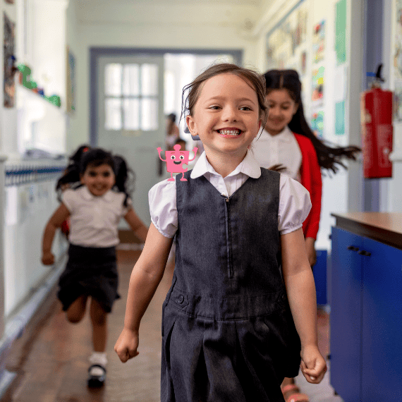 Children running in school corridor