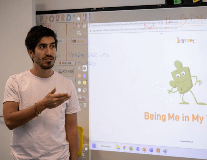 Teacher in front of a white board