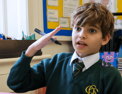 Boy talking holding a pen