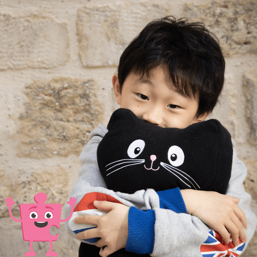 Boy cuddling Jerry cat