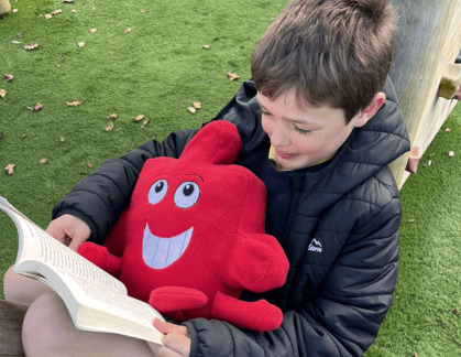 Boy holding Jigsaw character