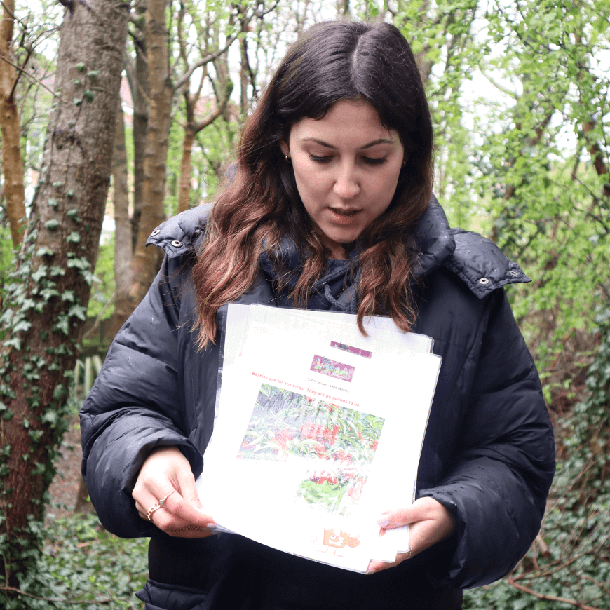 Teacher holding paper instructions