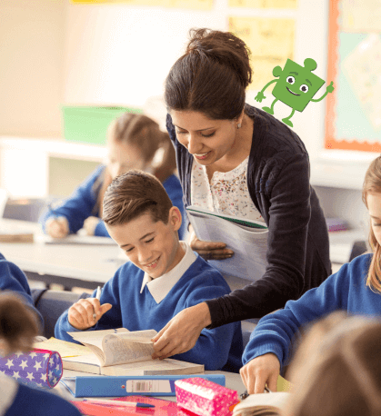 A teacher helping a boy work