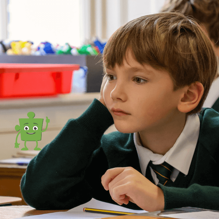 A young boy at the desk