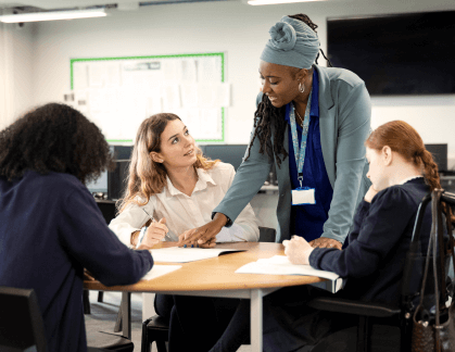 A teacher helping students