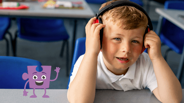 Boy in a class with headphones on