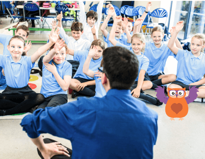 A classroom of children sitting down